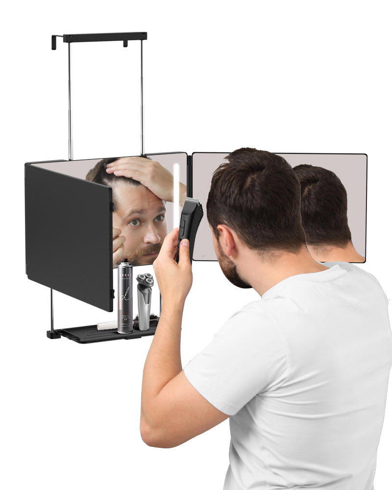 A man shaving his hair with Umitec Hook-on Trifold Mirror, the mirror has LED light and shelf